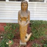 Mermaid statue made from wood, plaster, and paint