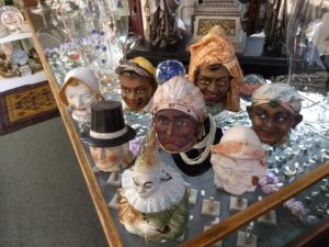 Doll Heads on top of estate jewelry display case