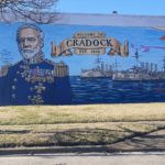 Mural of Admiral Cradock, his ships, and a pattern of waves