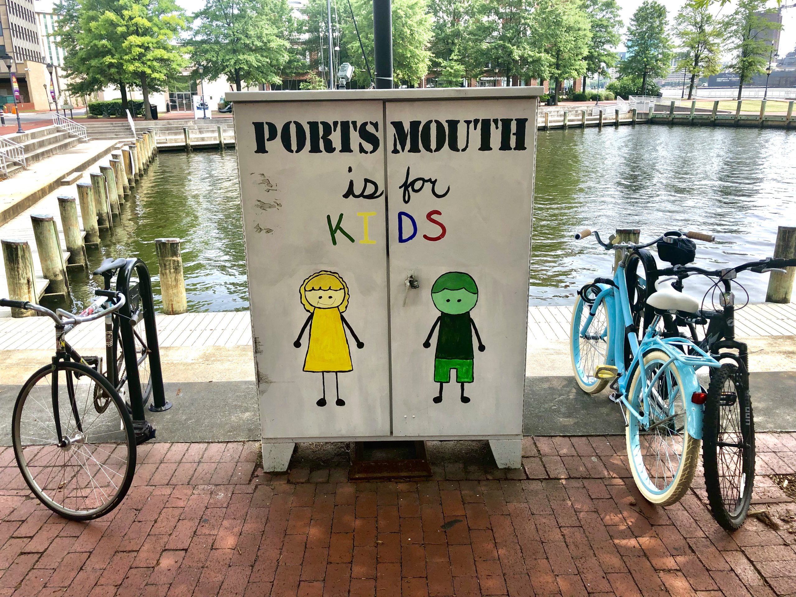 Electrical box with children painted on one side and the words Portsmouth is for Kids