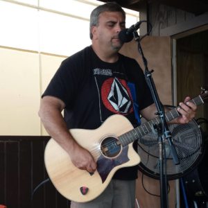 Musician Dan Rosnato plays guitar and sings