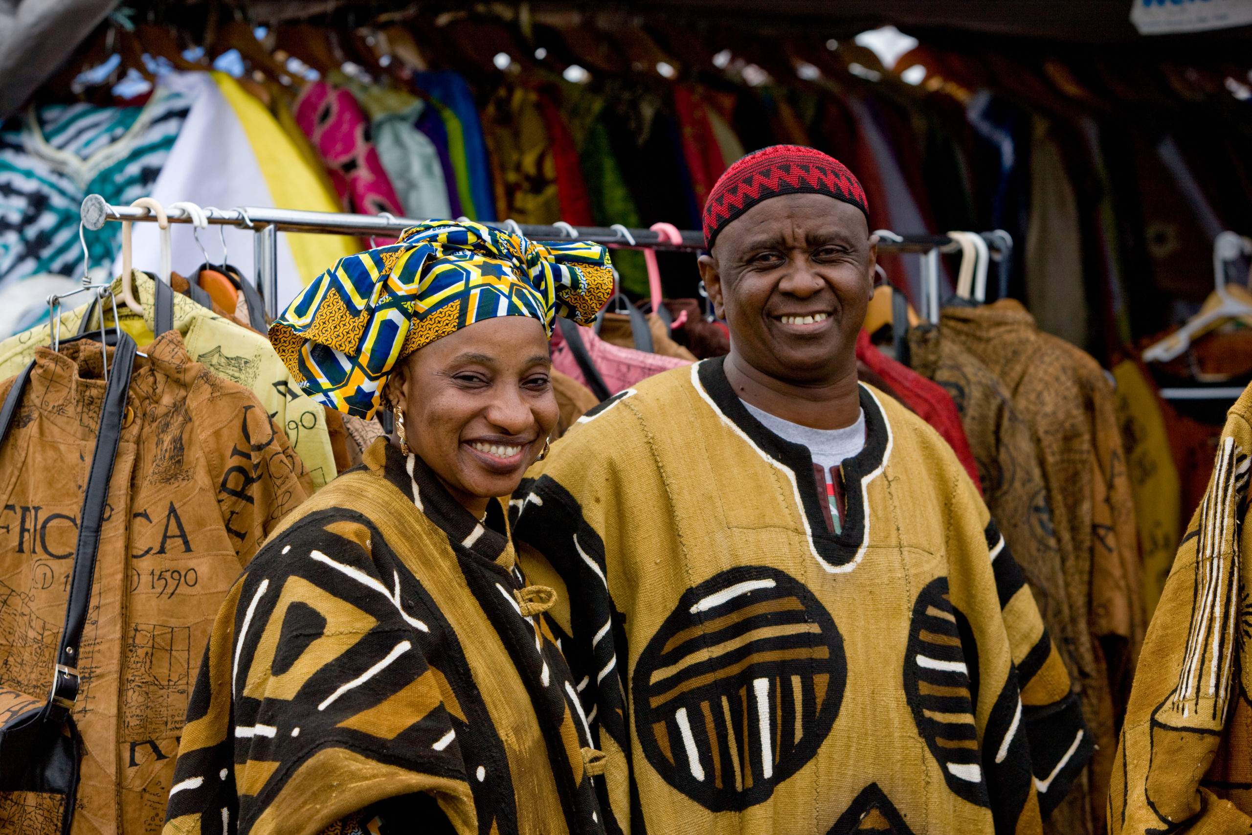 Couple with retail clothing display at Umoja Festival