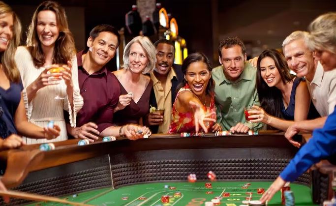 group of people around a casino gaming table at rivers casino Portsmouth